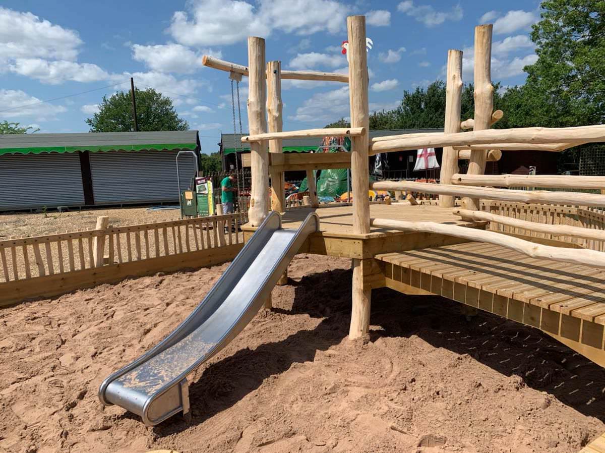 Slide within the sandpit at Wroxham Barns