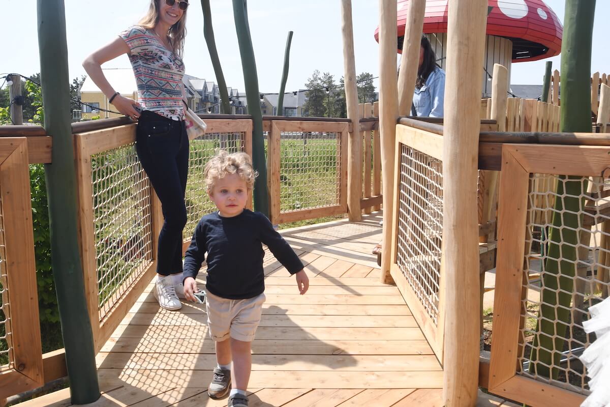 A toddler explore the walkways at Fairy Dell adventure play by CAP.Co at Fairytale Farm