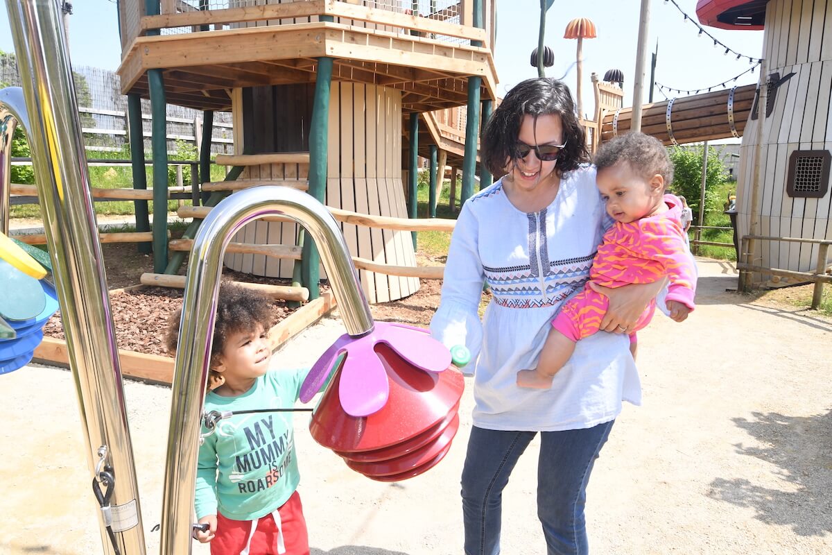 Mum and two kids with the outdoor acoustic instrument at Fairy Dell with adventure play by CAP.Co at Fairytale Farm