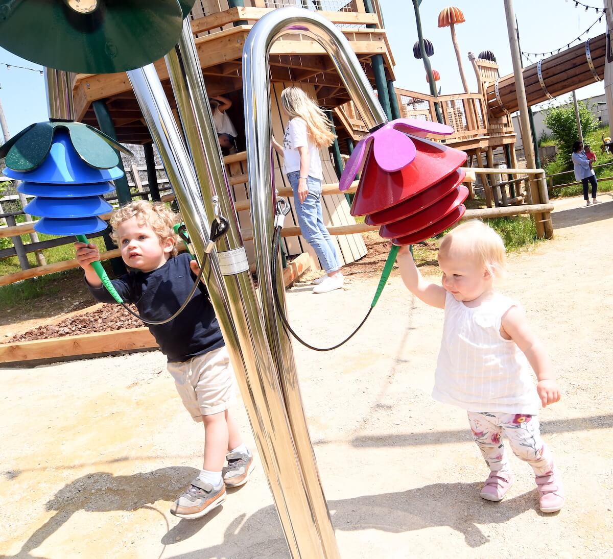 two kids enjoying the acoustic instrument at Fairytale farm with new adventure play the Fairy Dell by CAP.Co