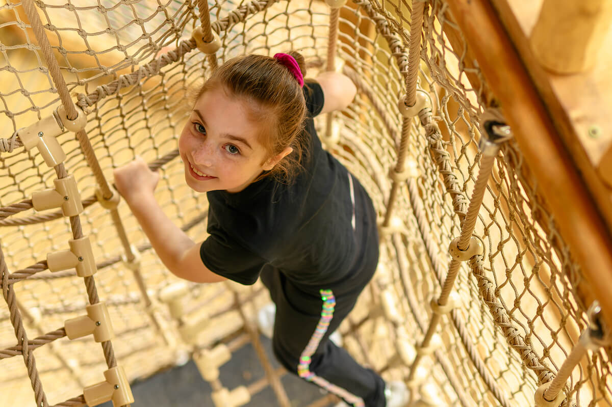 Climbing through Hermits Hollow at Coombe Country Park with Adventure play by CAP.Co