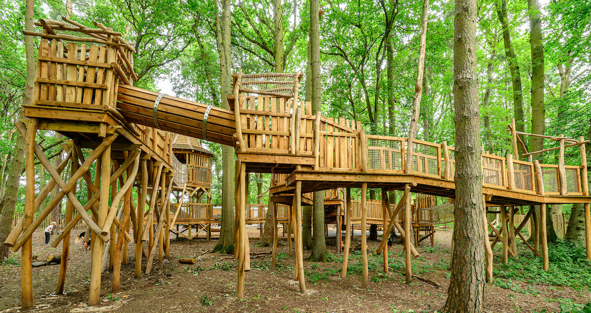 Side view of Hermits Hollow at Coombe Country Park with Adventure play by CAP.Co