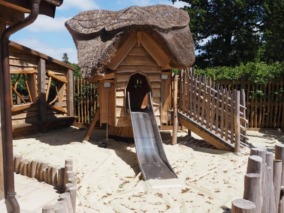 Small slide into the safety sand within the Courtyard Play for Toddlers at Windsor Great Park