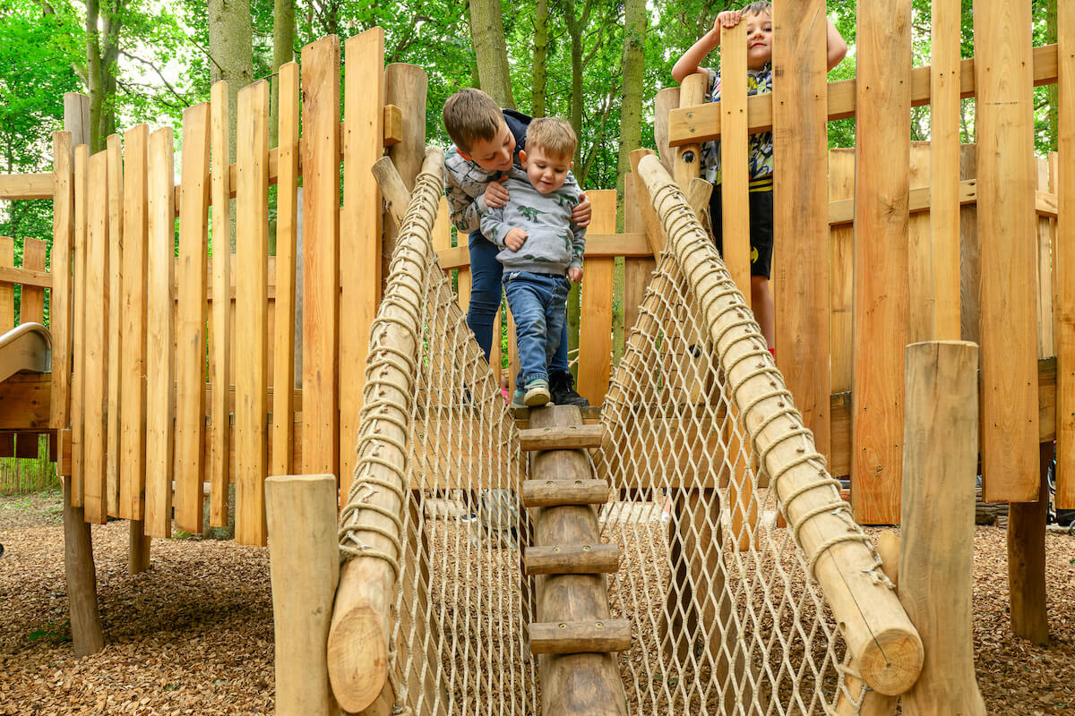 Tackling the toddler play at Hermits Hollow at Coombe Country Park with Adventure play by CAP.Co