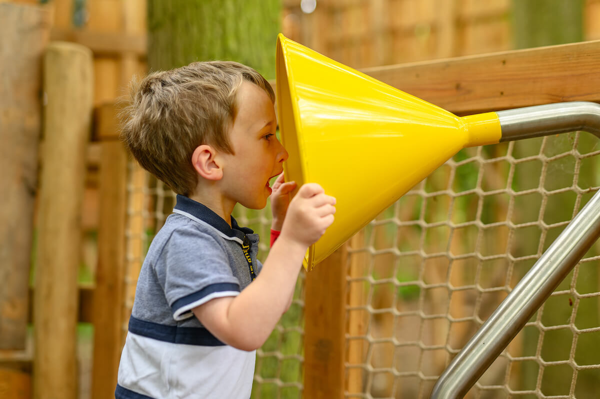 Testing the speaking tubes at Hermits Hollow at Coombe Country Park with Adventure play by CAP.Co