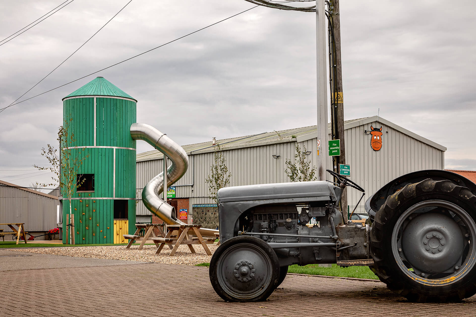 Rand Farm Park playground built by CAPCO architectural shot with old tractor in foreground