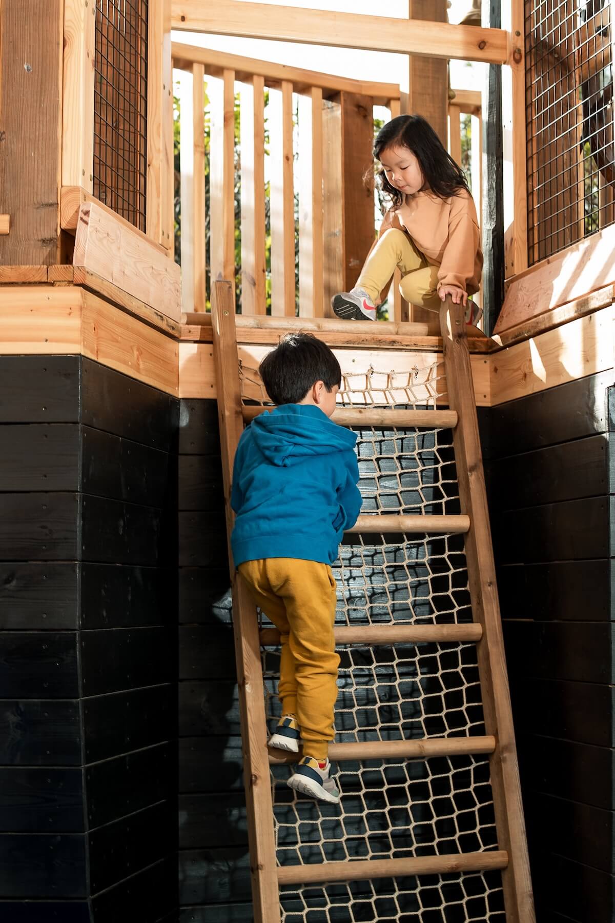 Climbing up a level at The Cove at the National Maritime Museum Inclusive play by CAP.Co