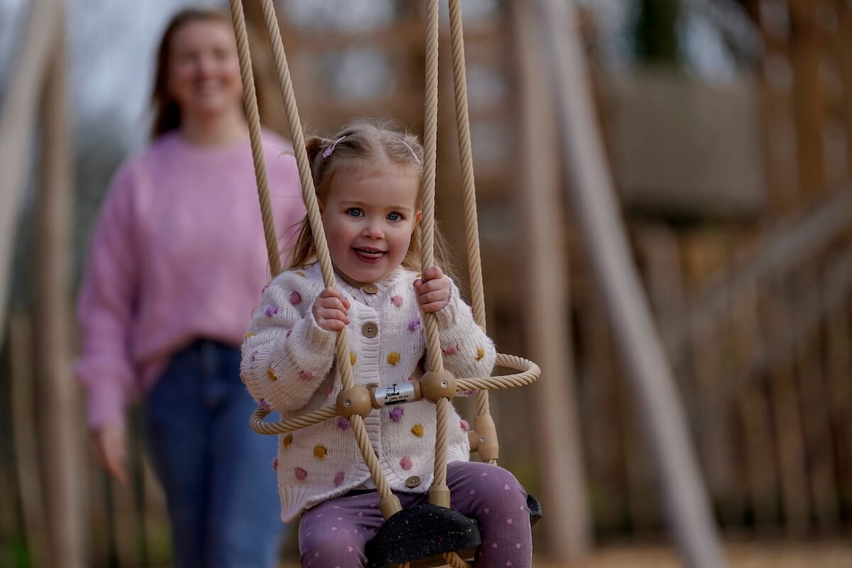 Enjoying some swing time at The Lost Garden within Blenheim Palace Adventure Play by CAP.Co