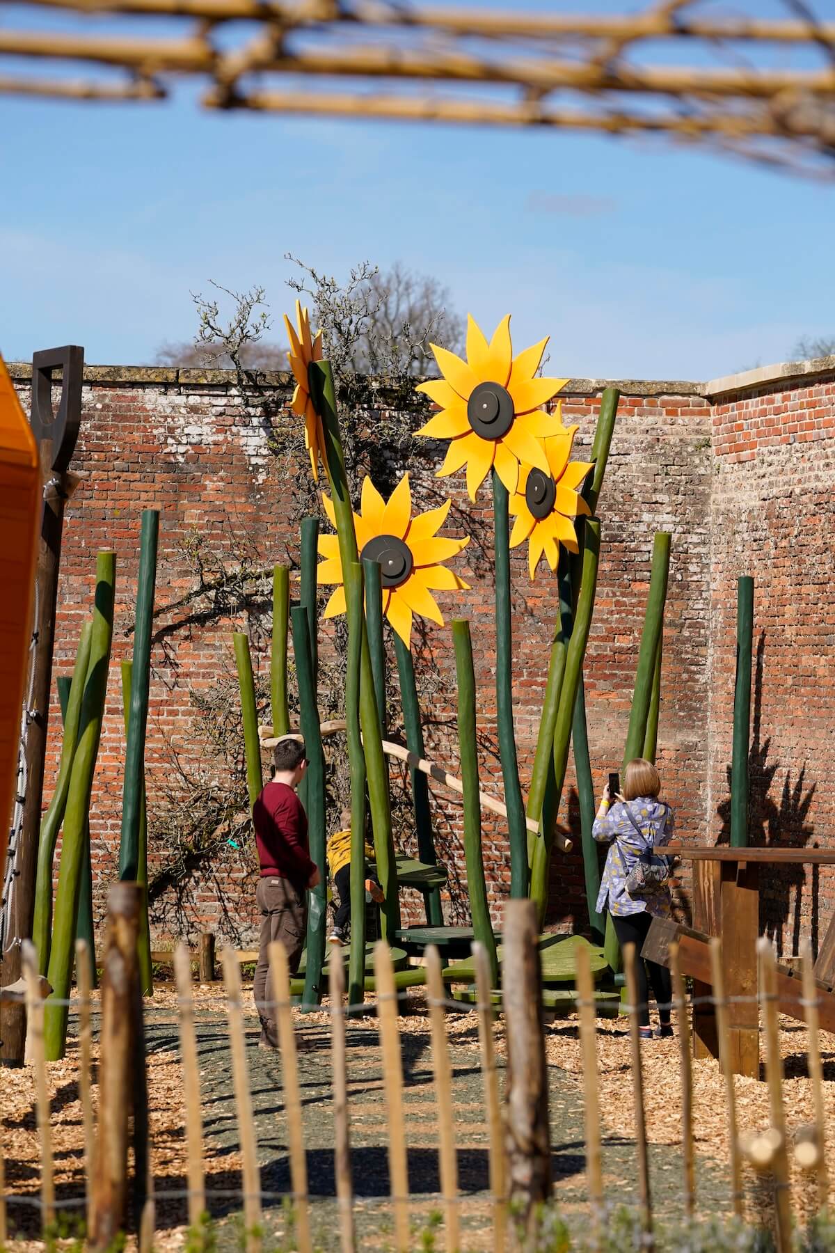 Giant sunflowers at The Lost Garden within Blenheim Palace Adventure Play by CAP.Co