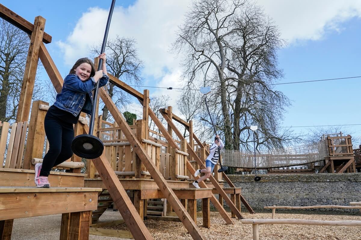 Jumping into the sip wires at The Lost Garden within Blenheim Palace Adventure Play by CAP.Co