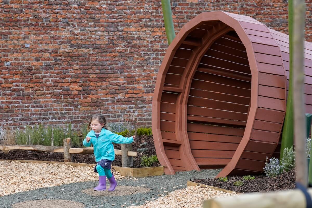Running away from a giant flower pot gate at The Lost Garden within Blenheim Palace Adventure Play by CAP.CoJPG