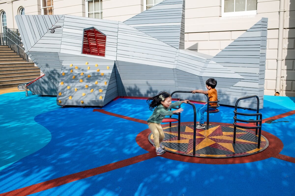 The Meridian roundabout and the Cutty Shark at The Cove at the National Maritime Museum Inclusive play by CAP.Co