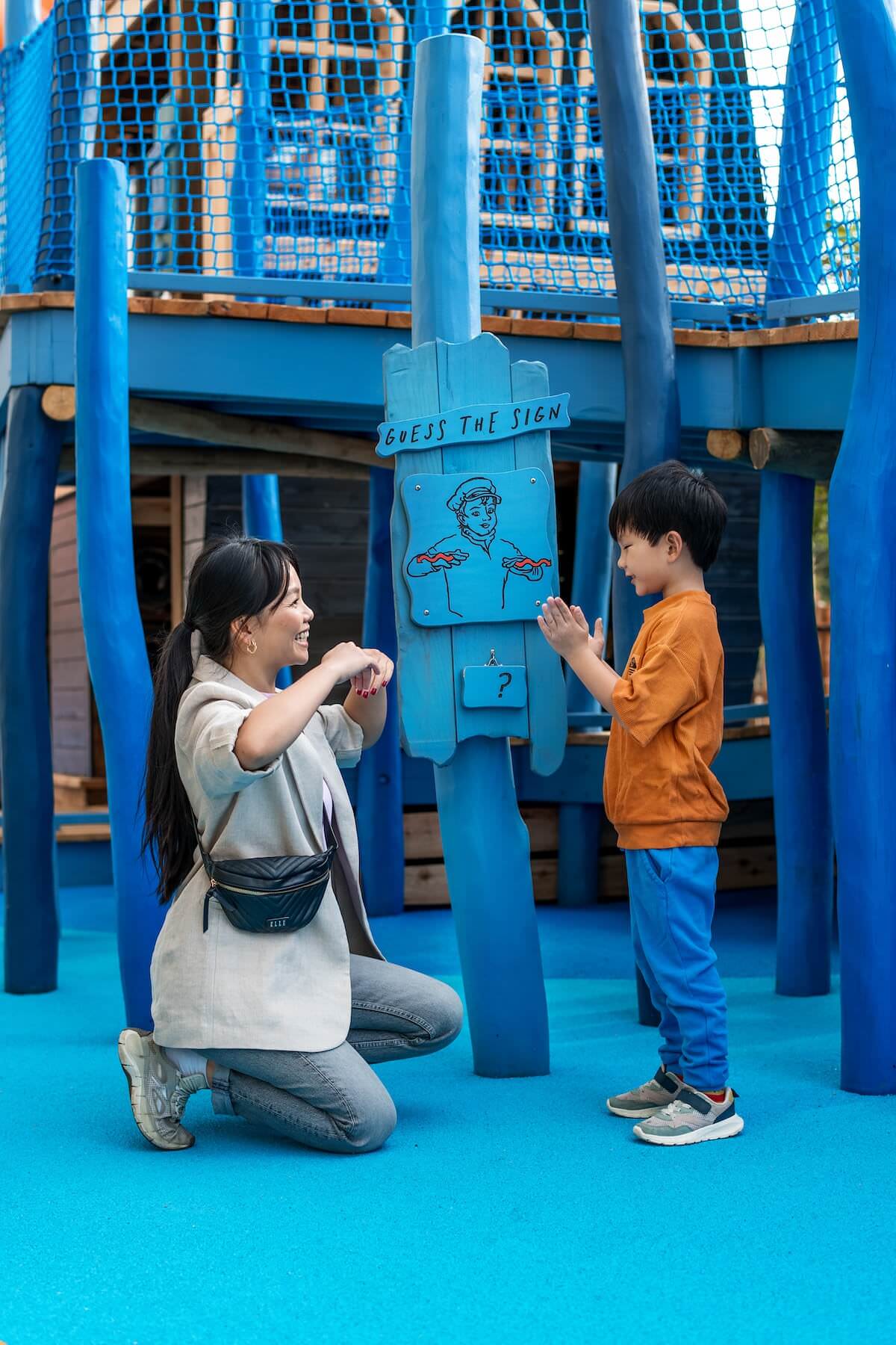 Two playing with the BSL sign language game at The Cove at the National Maritime Museum Inclusive play by CAP.Co