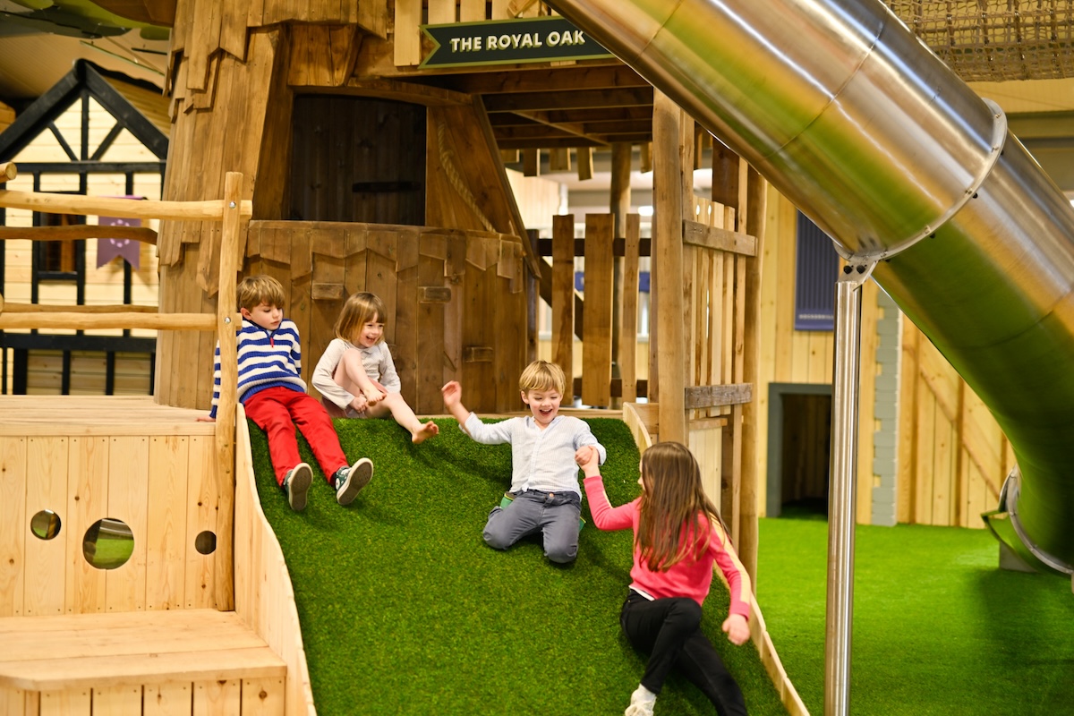Grassy slide at the Hockerhill Adventure Playbarn indoor and outdoor play in Staffordshire by CAP.CO