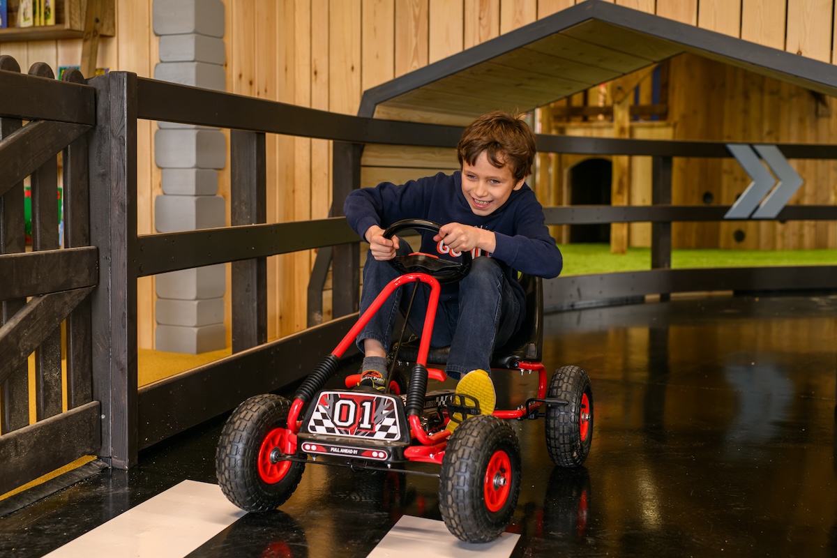 Speeding around the cart track at Hockerhill Adventure Playbarn indoor and outdoor play in Staffordshire by CAP.CO