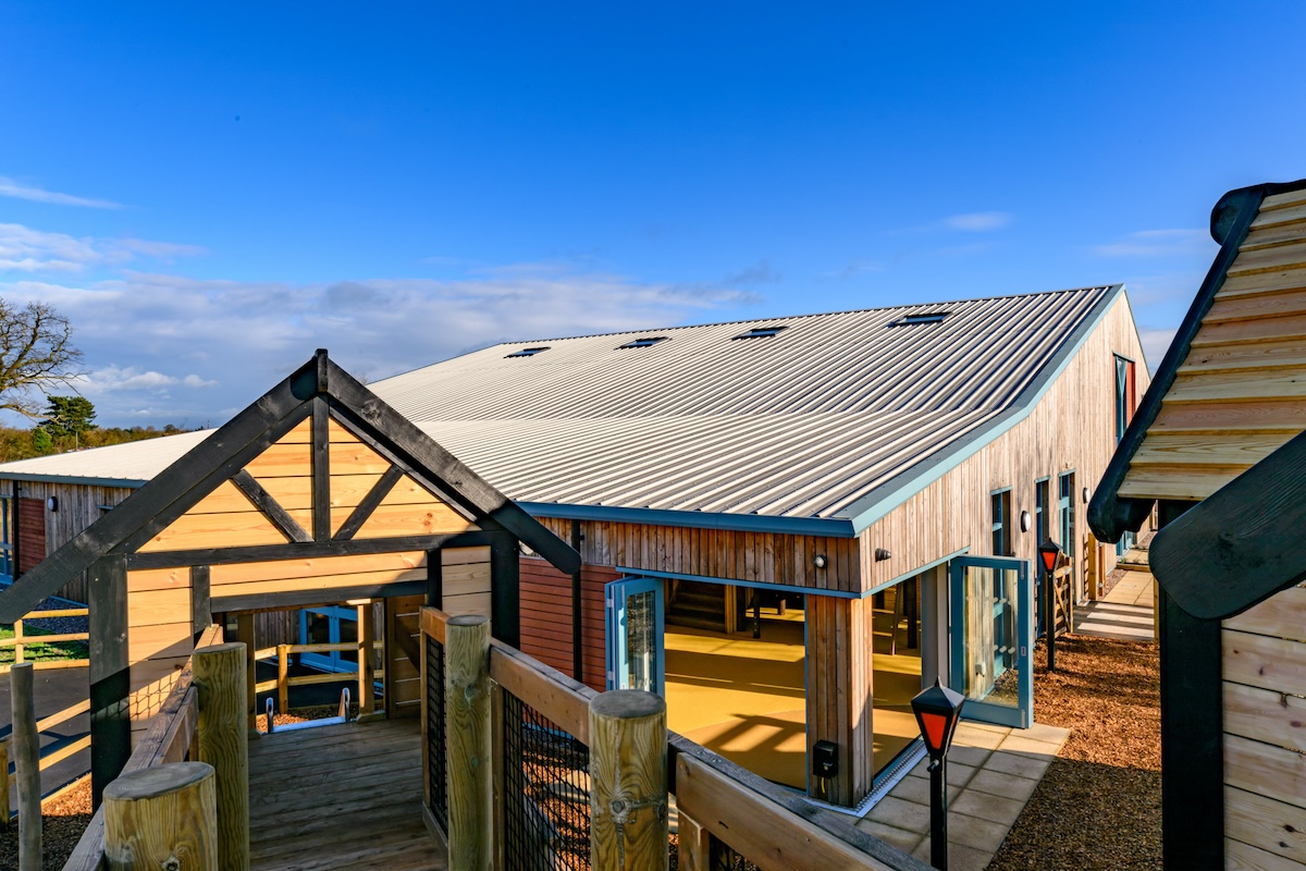The transition from indoor to outdoor play at Hockerhill Adventure Playbarn indoor and outdoor play in Staffordshire by CAP.CO
