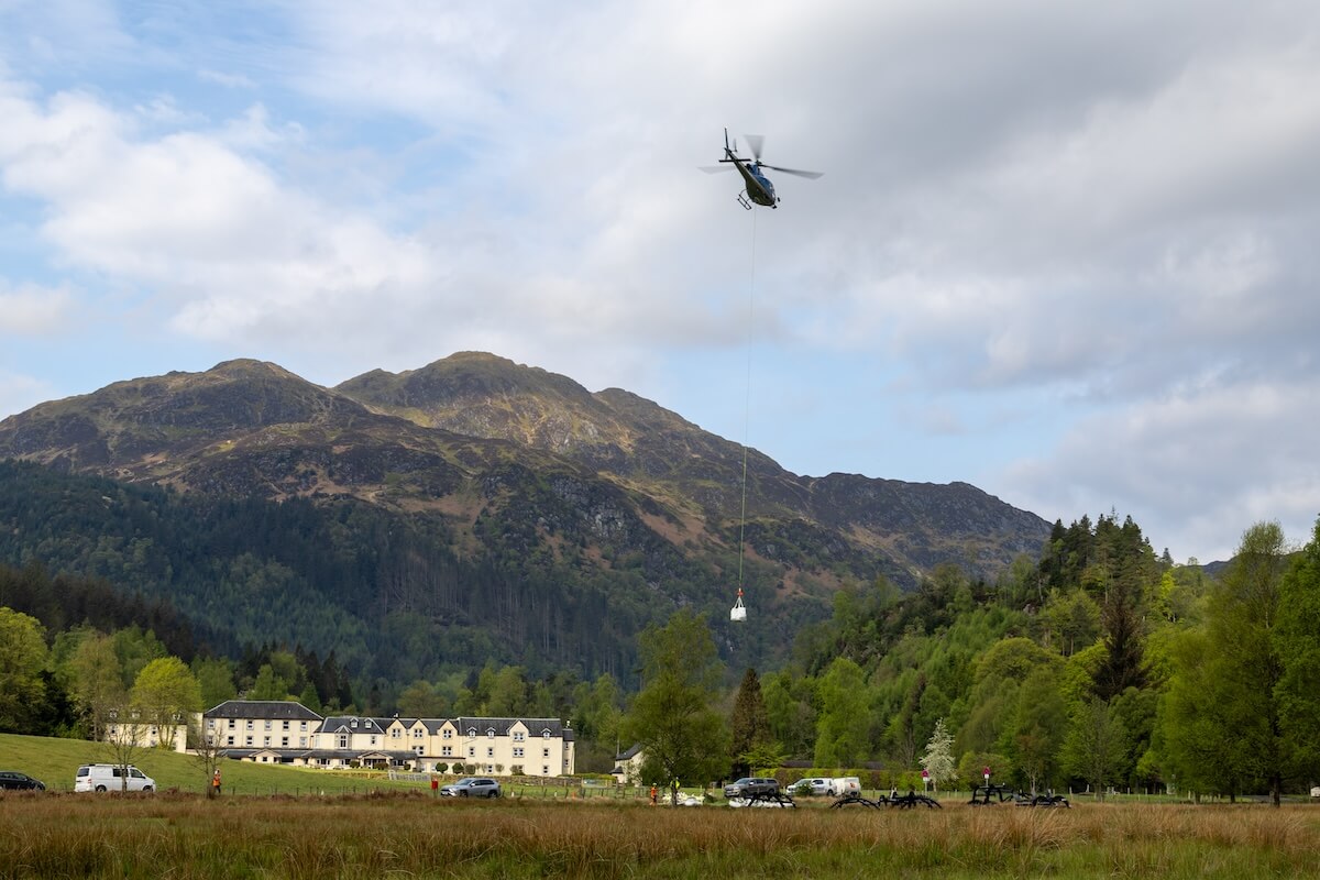 The helicopter lifts some of the materials to the top at Roderick Dhu lookout tower