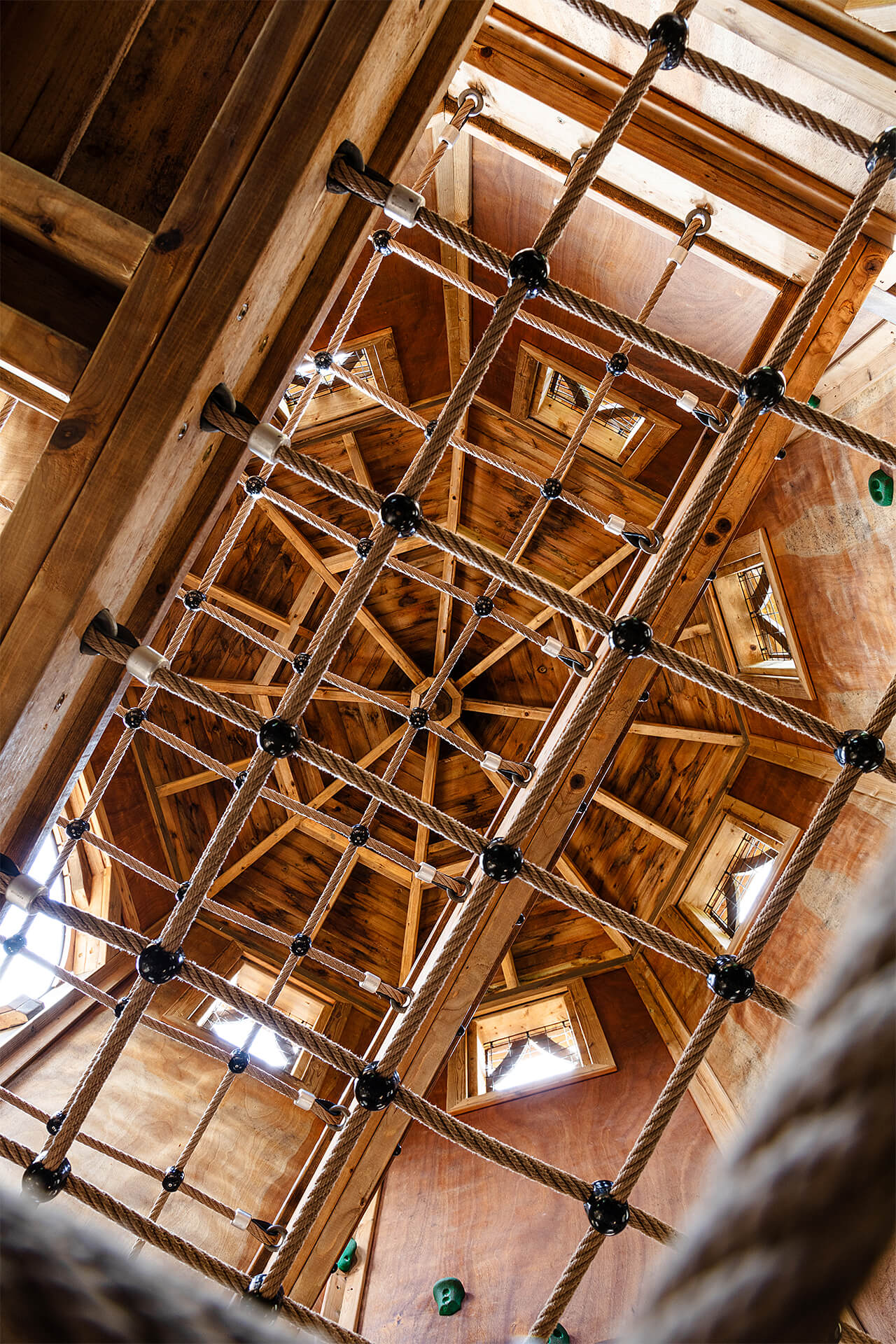 Looking upwards from floor level within Hide and Secrets adventure play at Burghley House by CAP.CO with photography by Kev Foster
