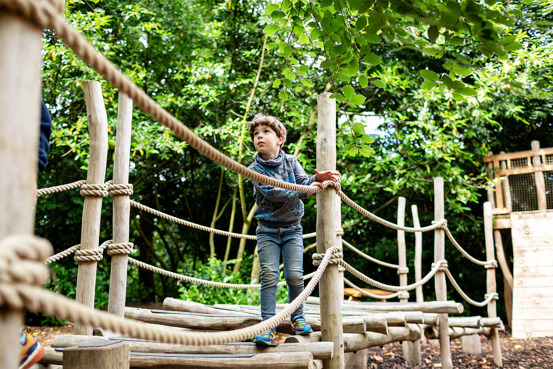 climbing across the Hide and Secrets adventure play at Burghley House by CAP.CO with photography by Kev Foster