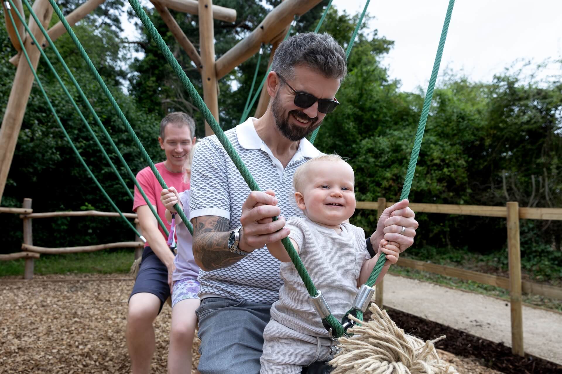 Family fun on the swings at Explorers Basecamp at Bristol Zoo Project designed and built by CAP.CO