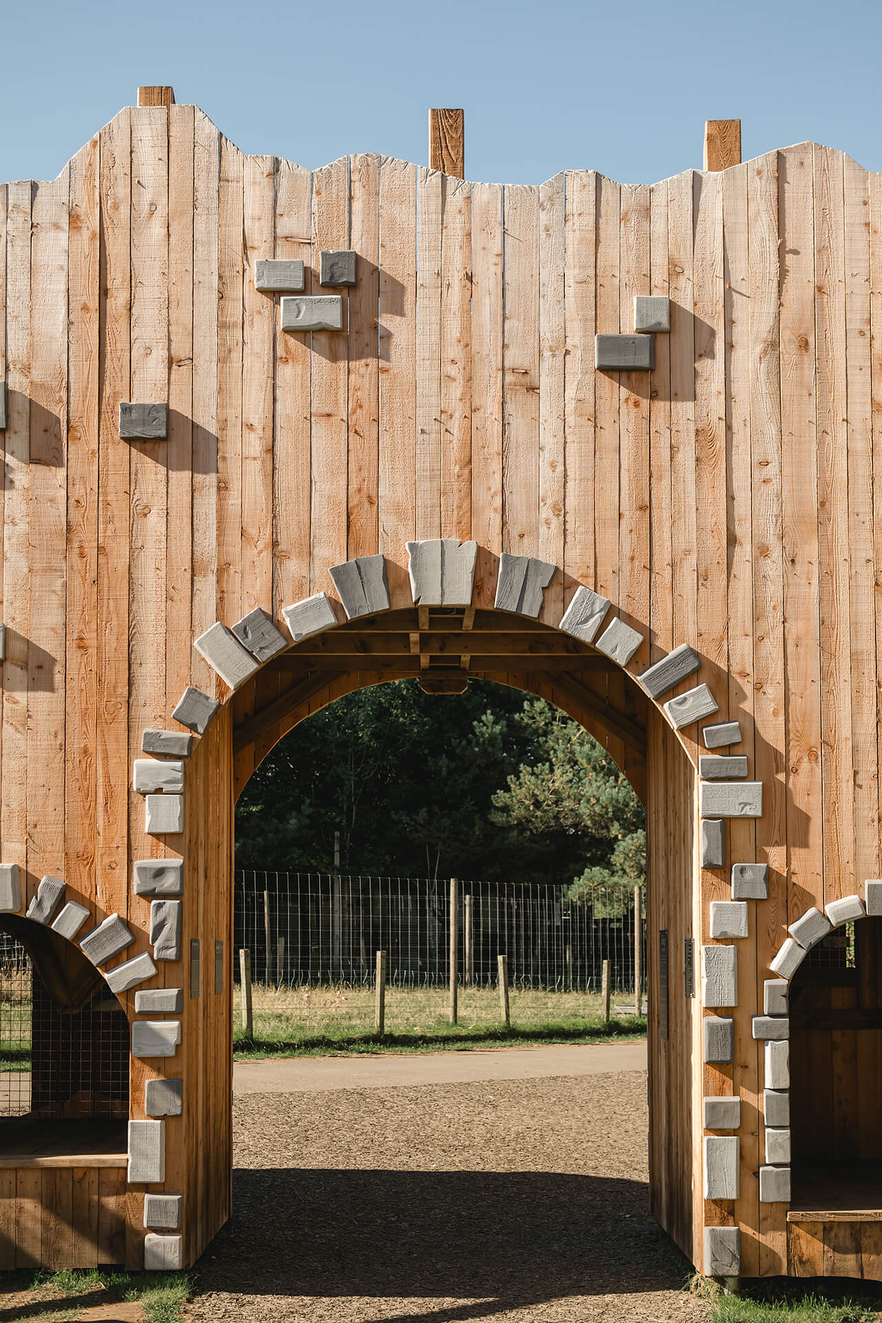 Entrance gate to the Ruined Peel at the CAP.CO built adventure playground at Almond Valley photography by Lindsey Mack