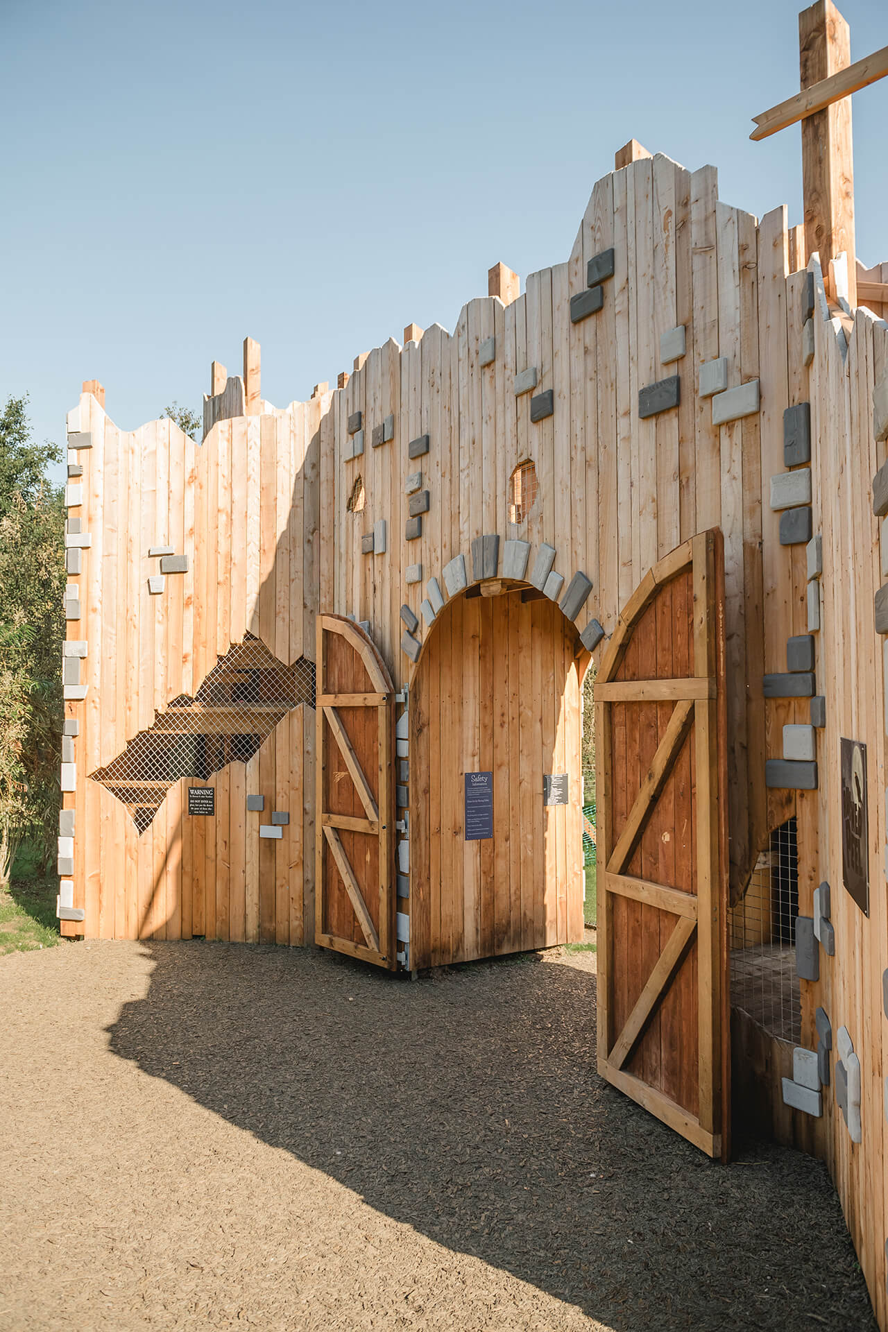 Entrance to the Ruined Peel CAP.CO built adventure playground at Almond Valley photography by Lindsey Mack