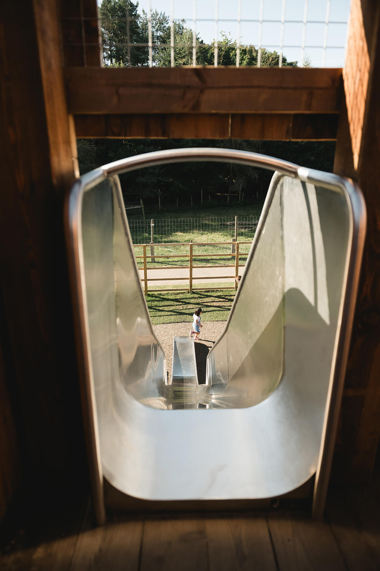 Image at the top of a slide at the CAP.CO built adventure playground at Almond Valley photography by Lindsey Mack