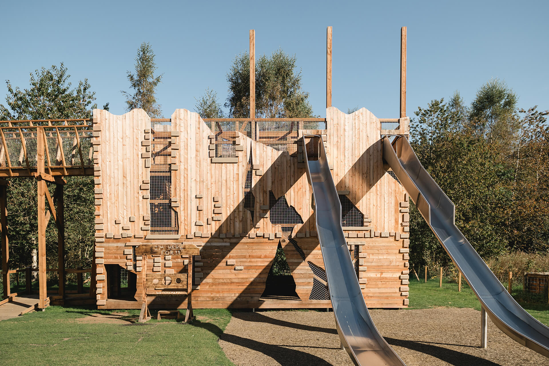 Ruined Peel racing slides at the CAP.CO built adventure playground at Almond Valley photography by Lindsey Mack