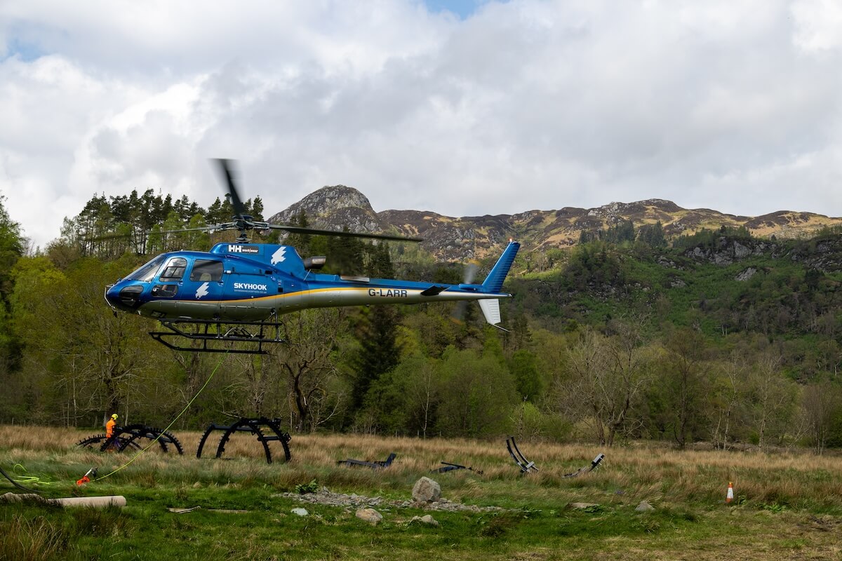 The helicopter begins the lift at the Roderick Dhu lookout tower