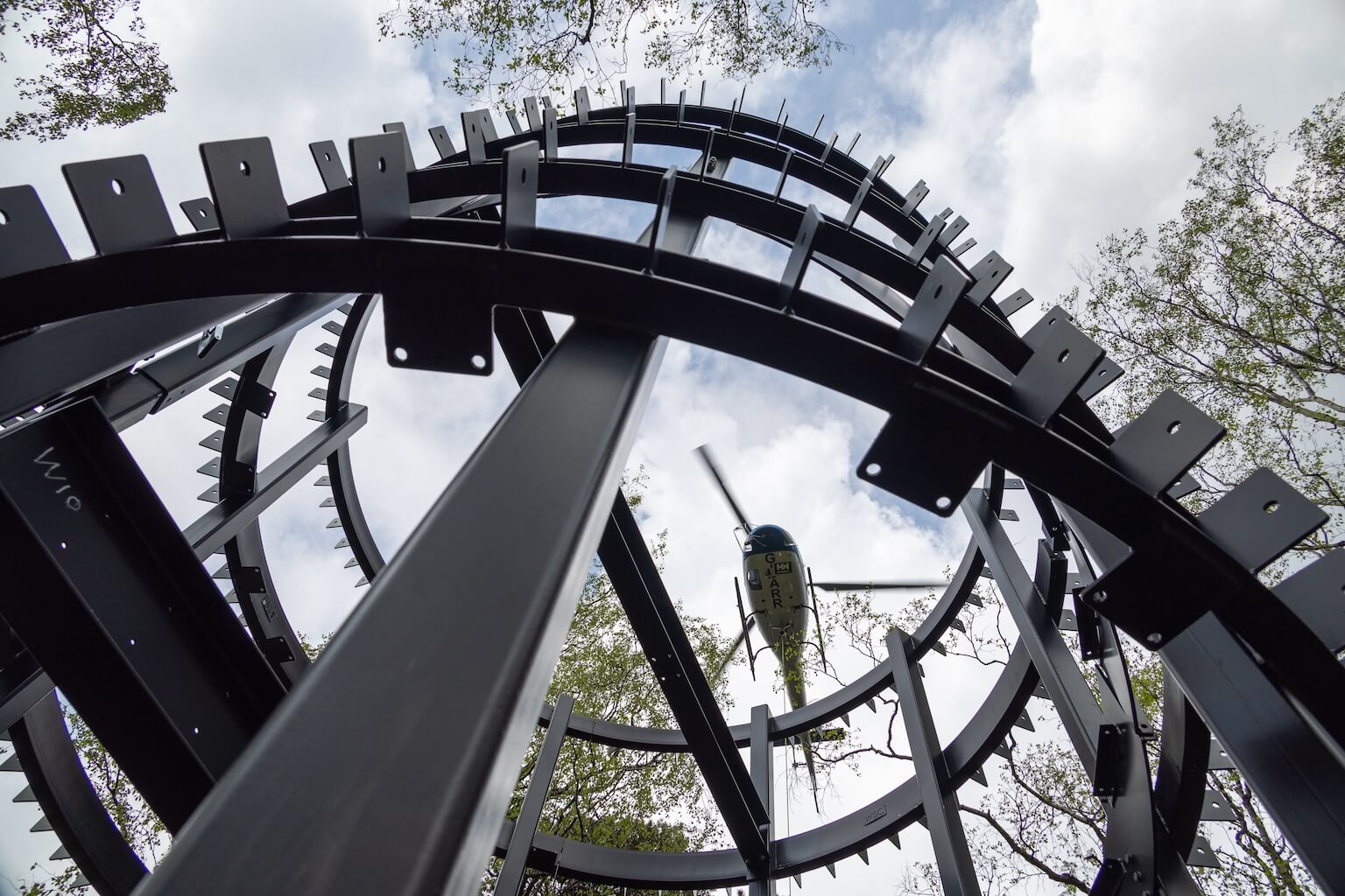 The view from underneath as the helicopter deliver the parts into the Roderick Dhu lookout tower