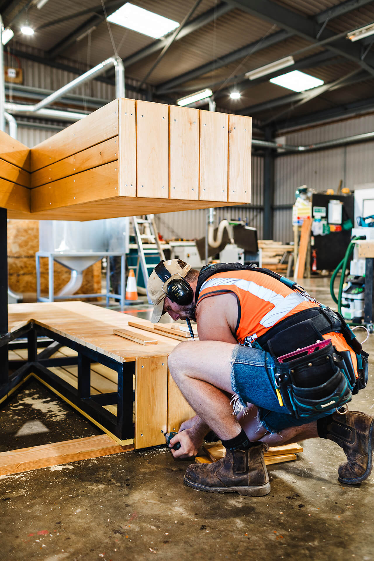 CAPCO carpenter prefabricating a play structure for Poringland school photography by Kev Foster