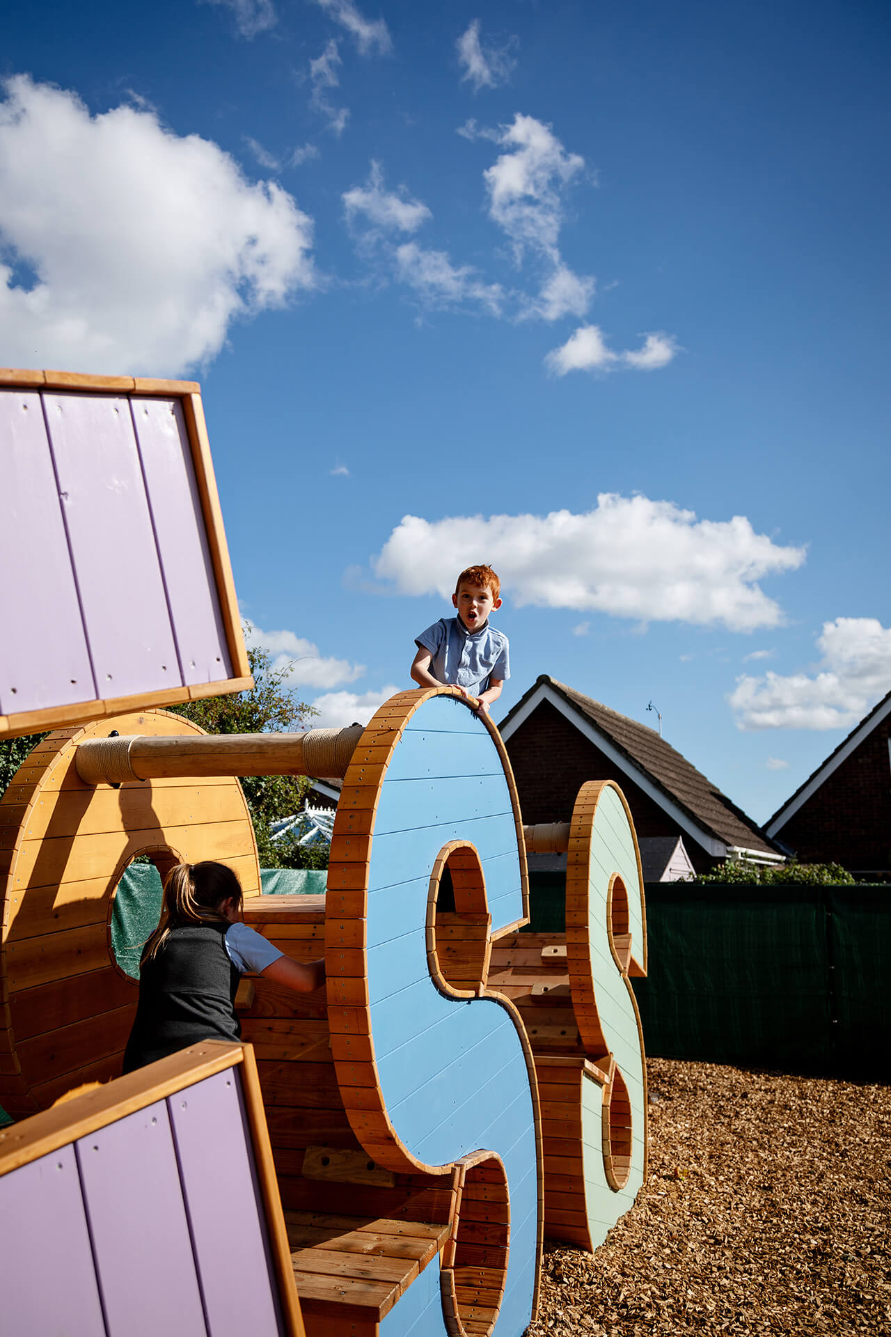 Little boy playing and climbing on the Poringland School Kindness project built by CAPCO photography by Kev Foster