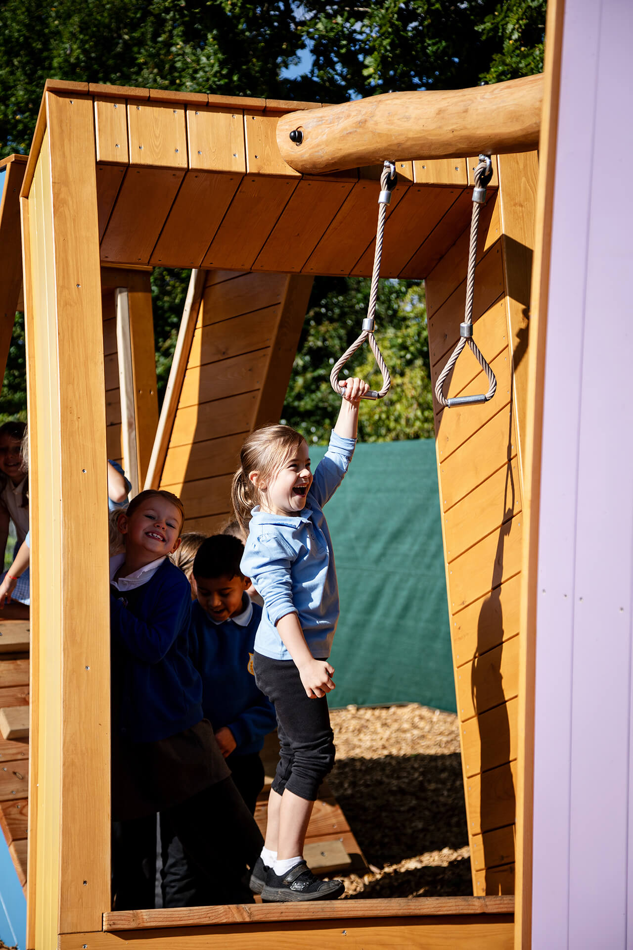 Little girl playing on the Poringland School Kindness project built by CAPCO photography by Kev Foster