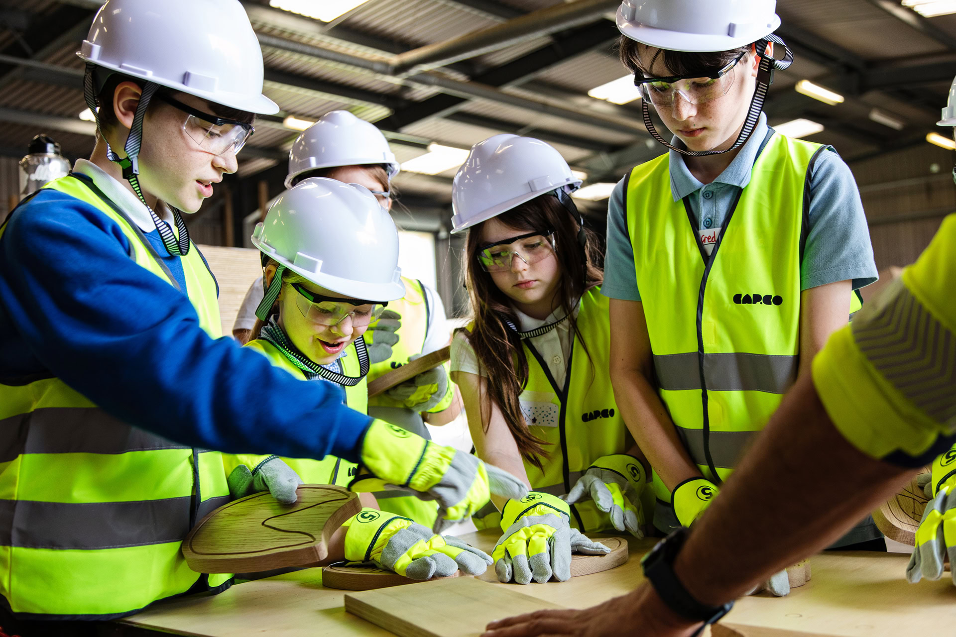 Poringland school visit to the CAPCO workshop Jack is showing them a build process photography by Kev Foster