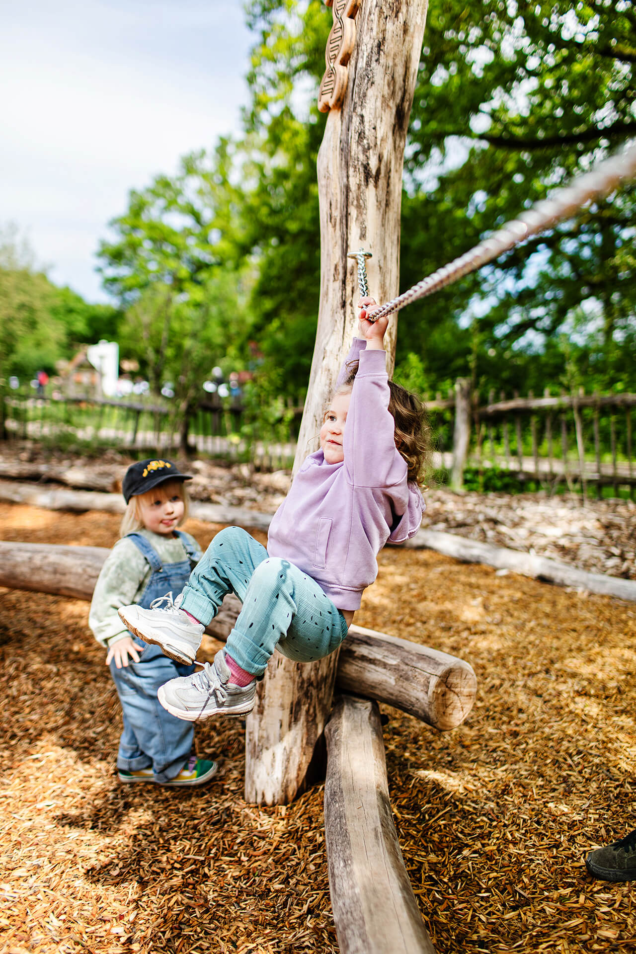 Swinging on the ground play at Parce Sainte Croix built by CAPCO photography by Kev Foster