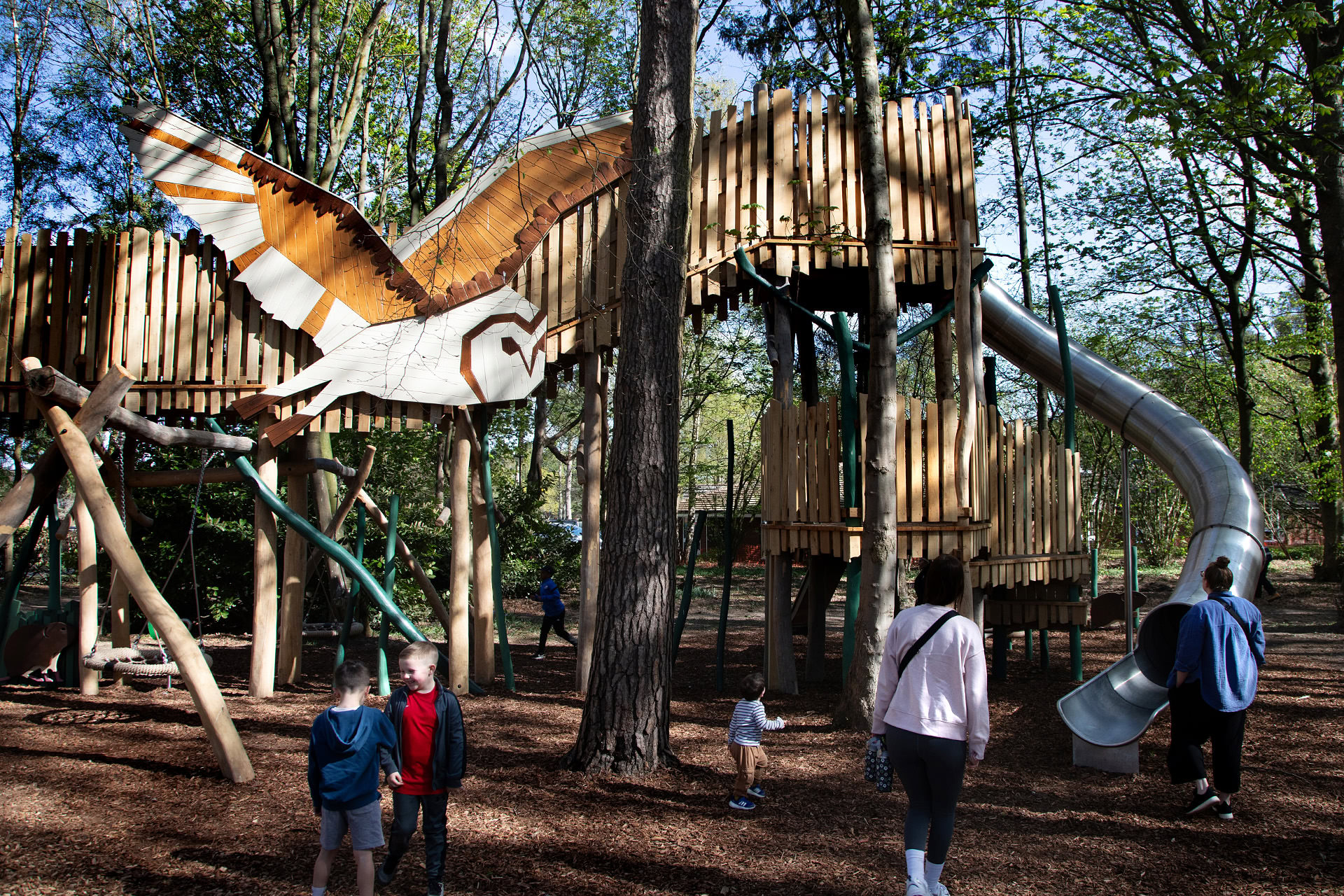 Children and families enjoying the Woodland Adventures playground at The Belfry Hotel built and designed by CAP.CO photography by Kev Foster