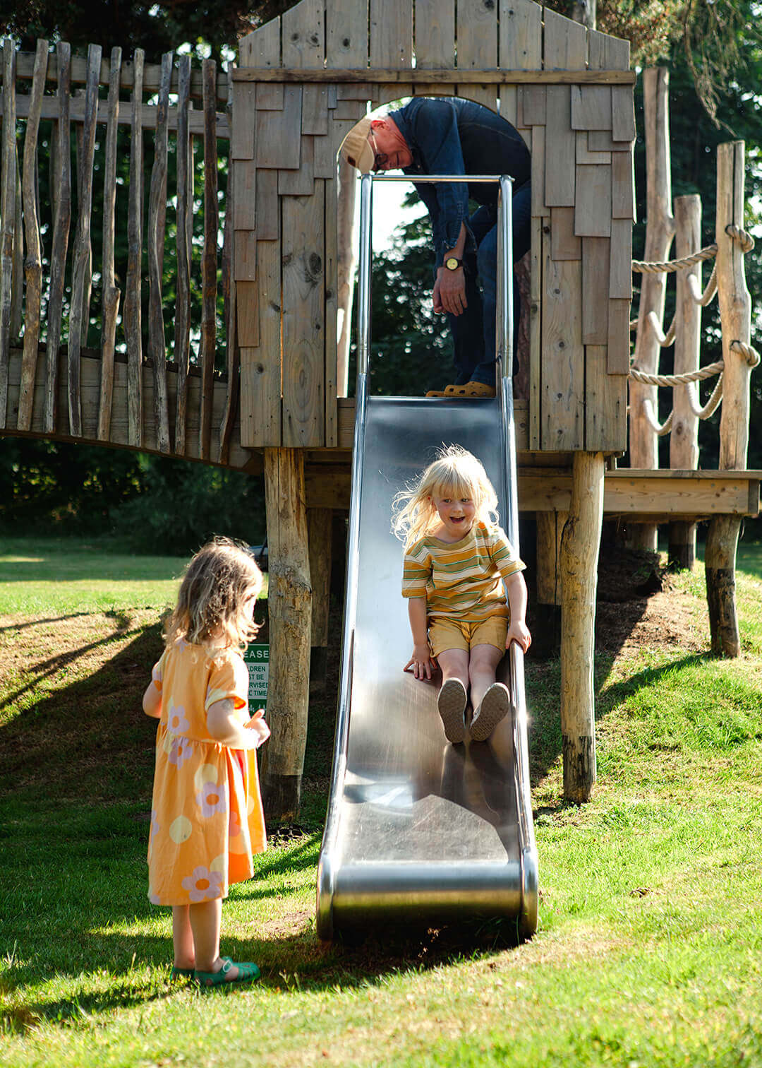 Coming down the slide at Scarborough Hill Country Inn Hotel pine tower playground built and designed by CAPCO photography by George Browne
