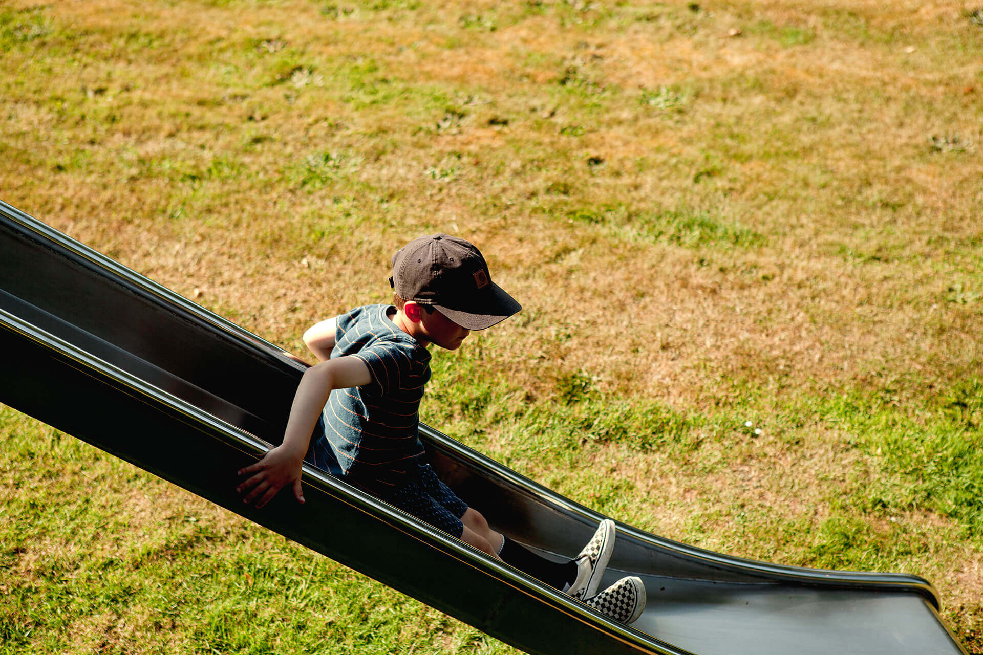 Sliding down the slide at Scarborough Hill Country Inn Hotel pine tower playground built and designed by CAPCO photography by George Browne