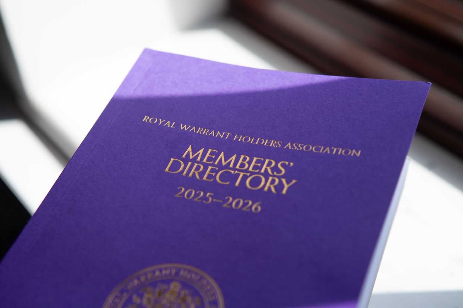 The cover of the Royal Warrant Holders Book with CAP.CO