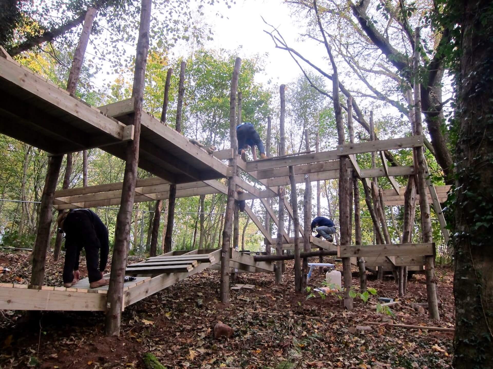 The team work on the slopes of the Culzean Castle site and build the play structures to follow the contours