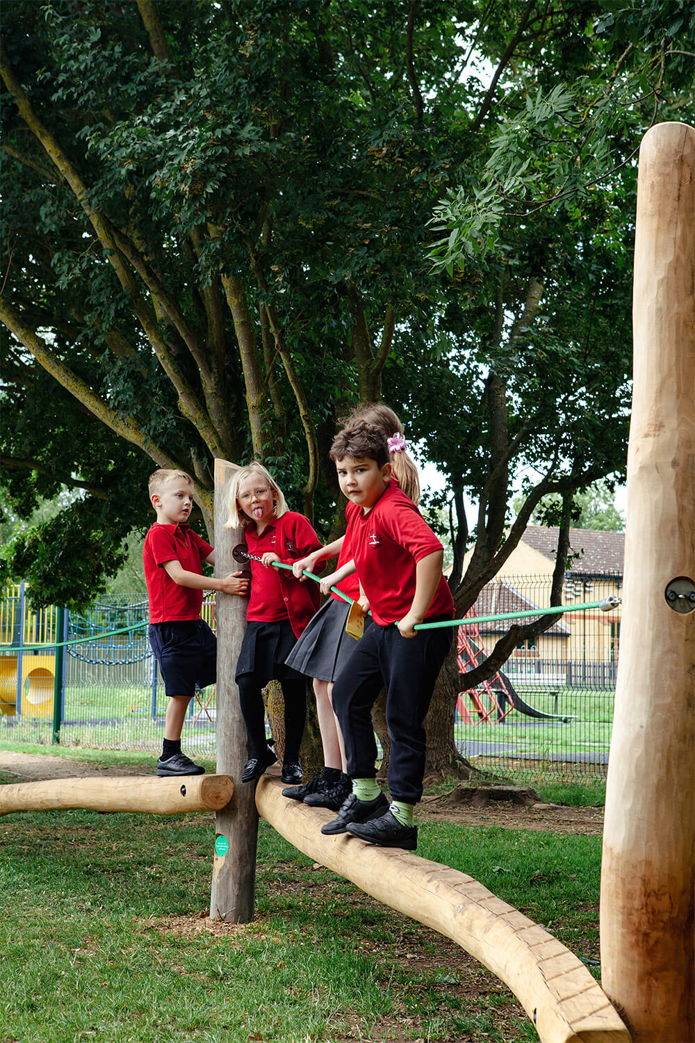 Children enjoying a CAP.CO designed ground play trail at Fen Drayton Primary School, primary school playground builders UK