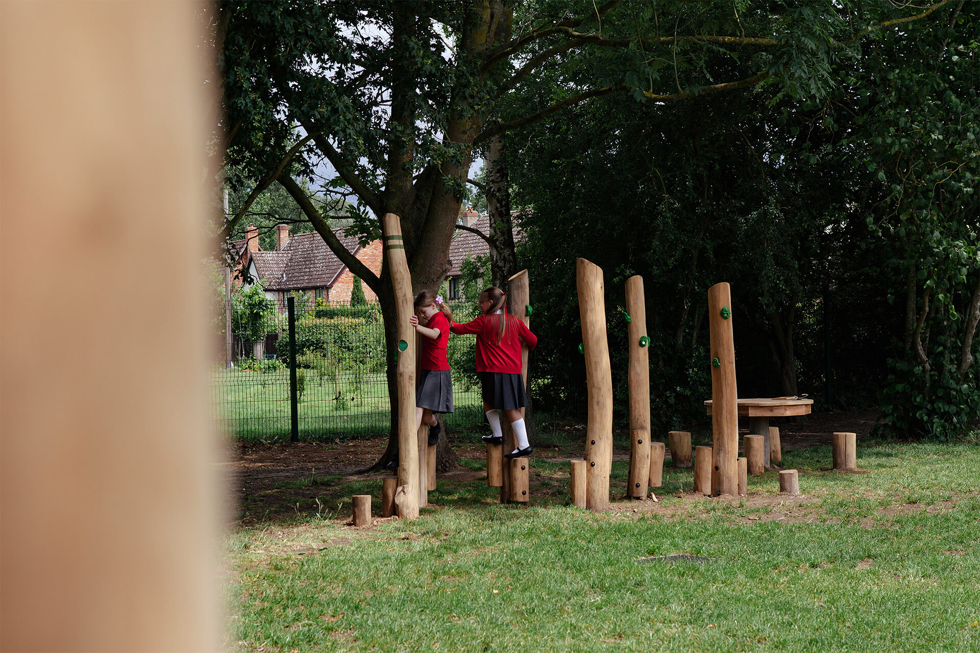 School playground design and installation by CAP.CO with children playing outdoors