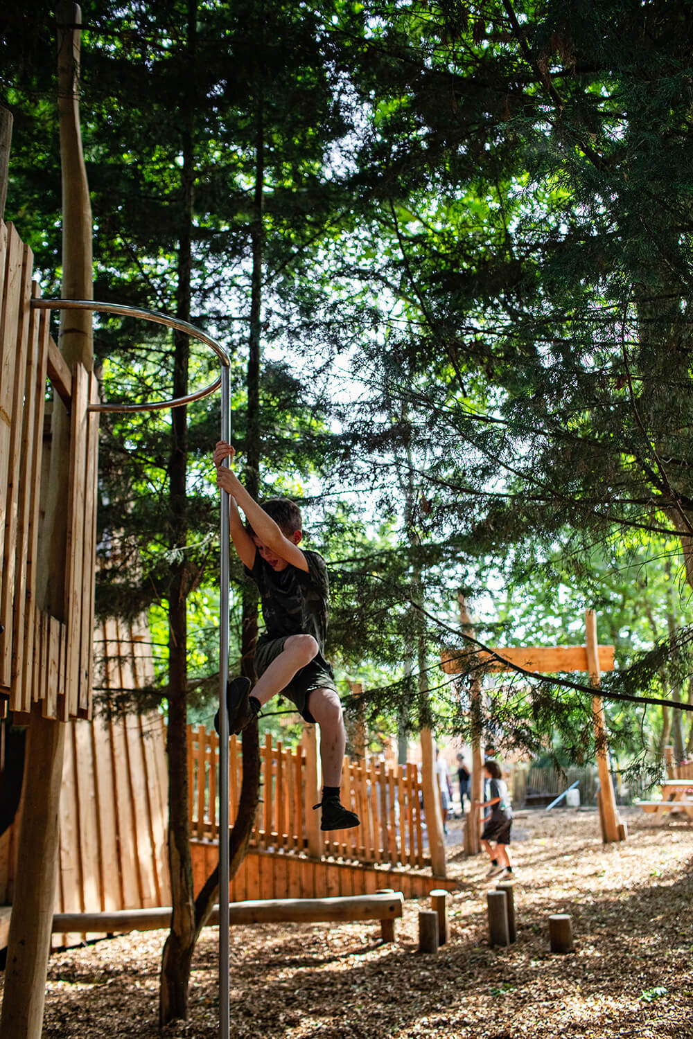 Children playing across the four themed zones of Guildenacre, a bespoke adventure playground by CAP.CO, photography by Kev Foster