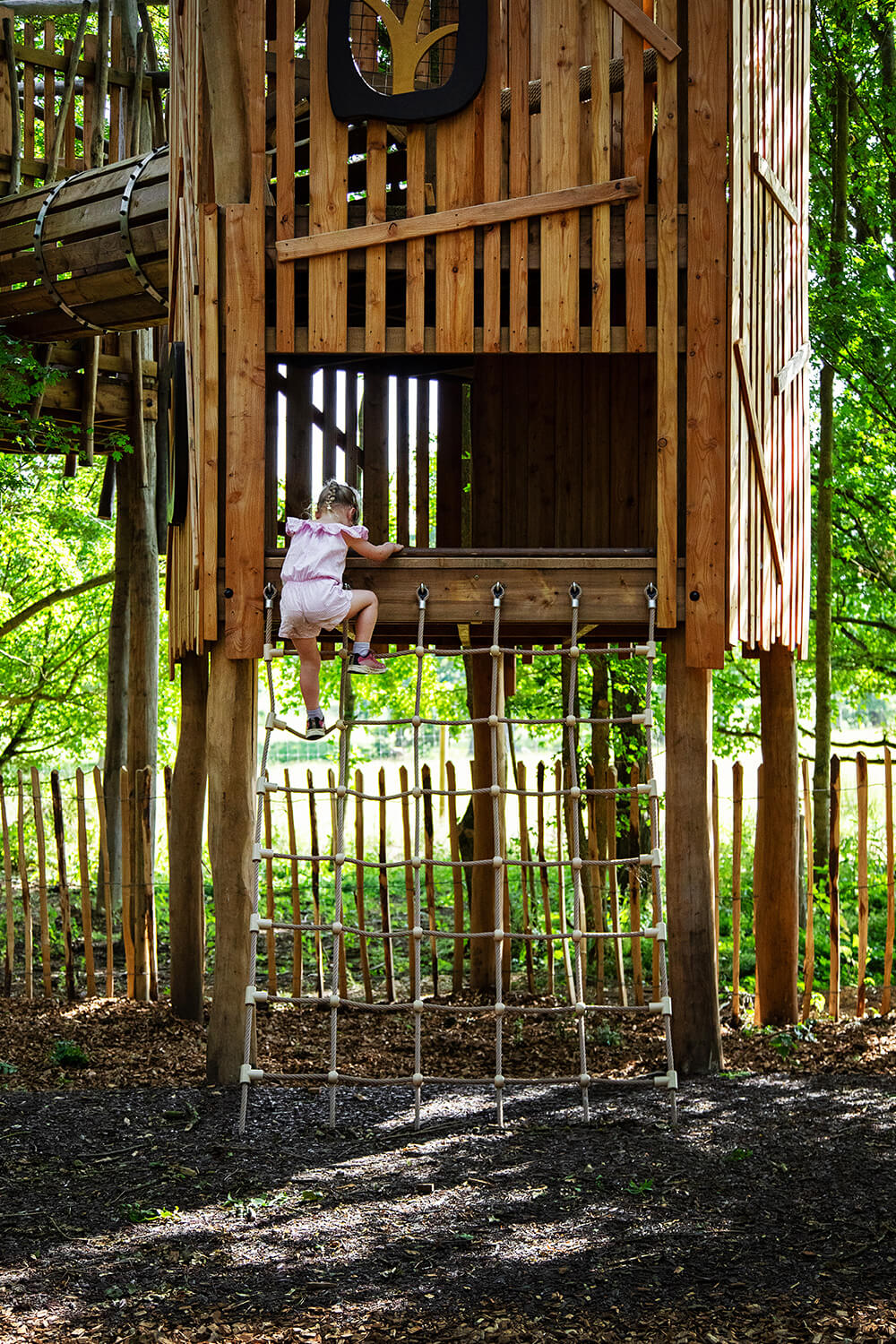 Eira the Owl's Canopy Keep elevated treehouse structure with rope ladder access by CAP.CO, photography by Kev Foster