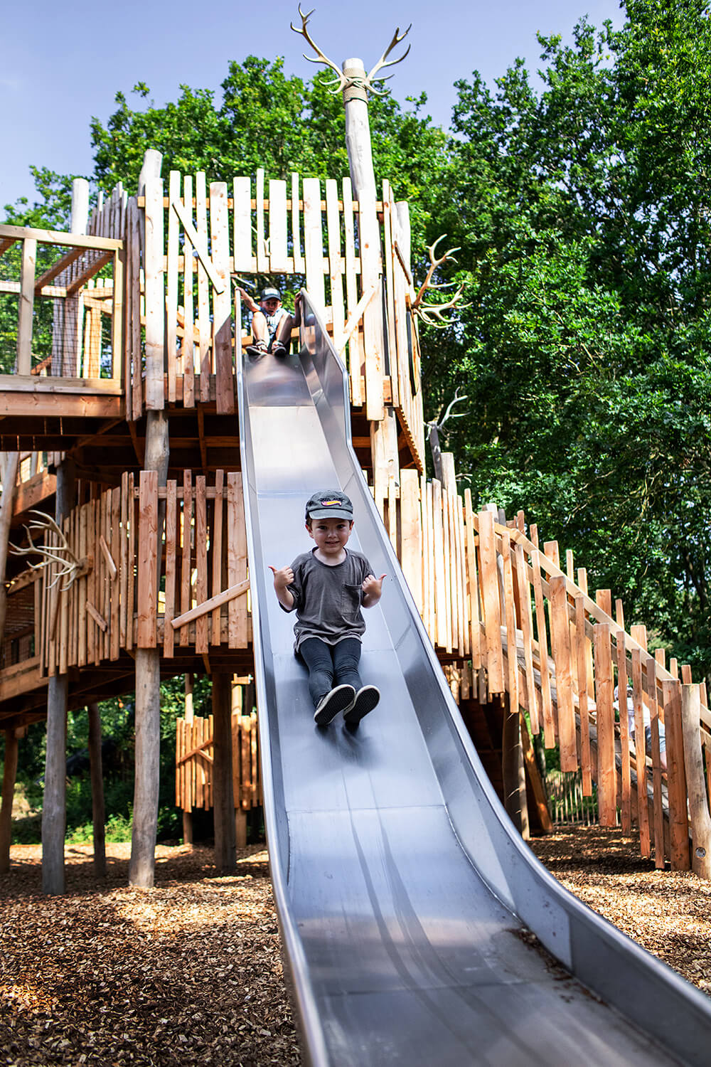 Giant racing slides at Guildenacre adventure playground at Helmingham designed and built by CAP.CO, photography by Kev Foster