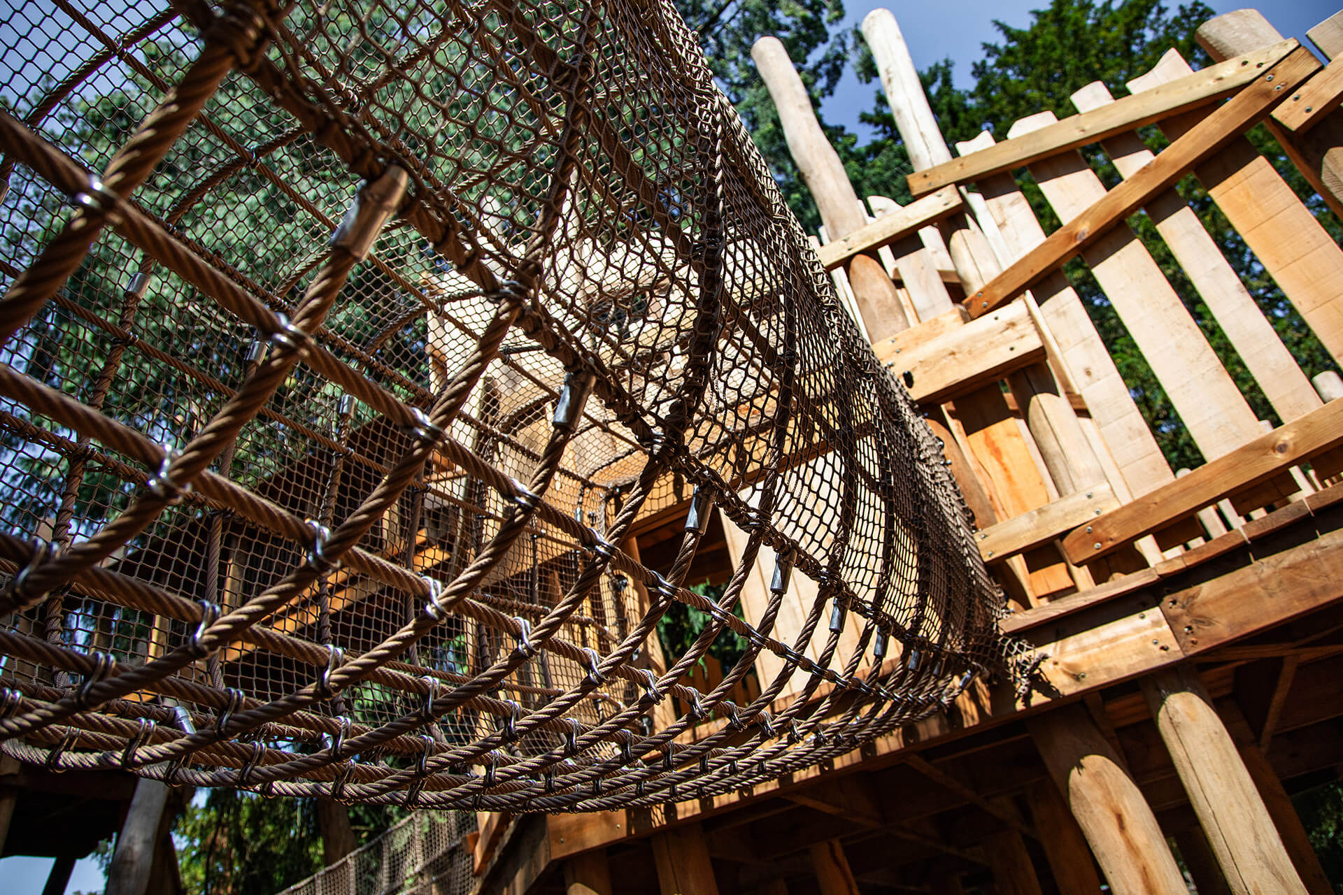 Cargo net bridge to crawl and navigate at The Sky Maze adventure playground at Cotswold Wildlife Park, designed and built by CAP.CO, photography by Kev Foster